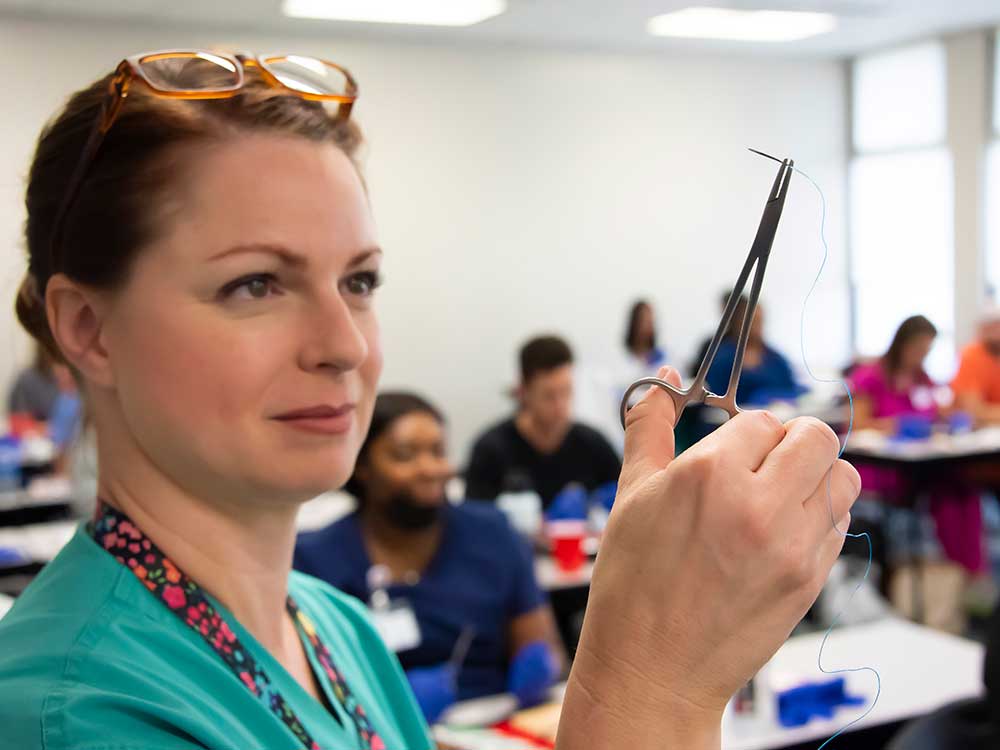 Nurse teaching a class of students