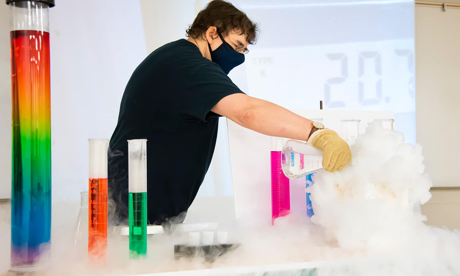 man mixing chemicals