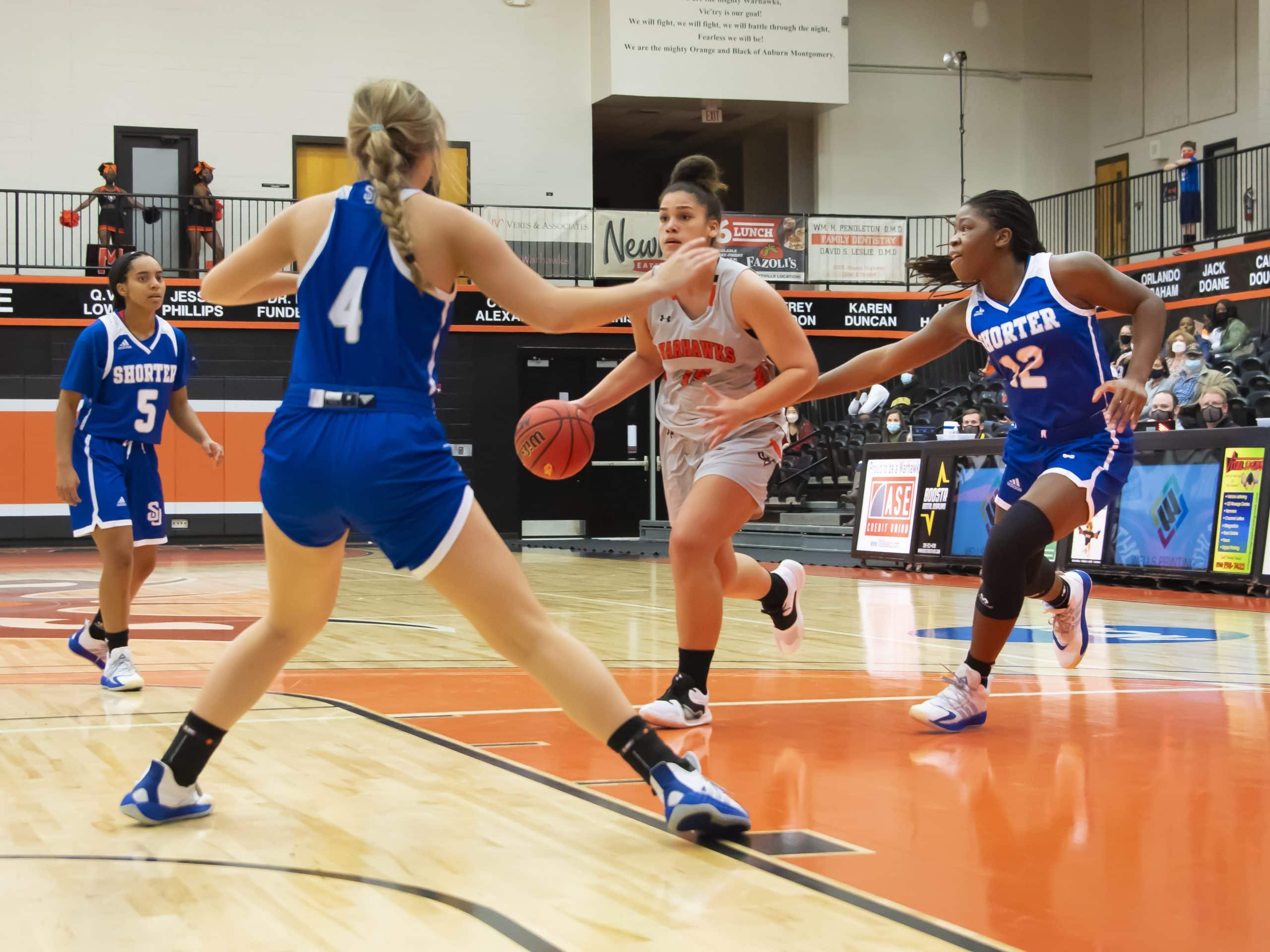 a group of people playing a game on the court