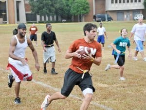 Students play flag football with intramurals.
