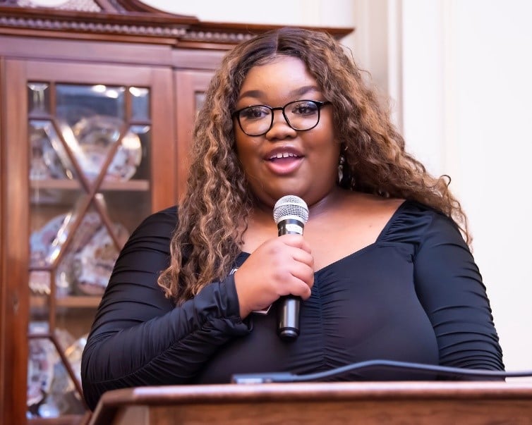 Shemekia Copeland wearing glasses and smiling at the camera