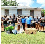a group of people standing in front of a house