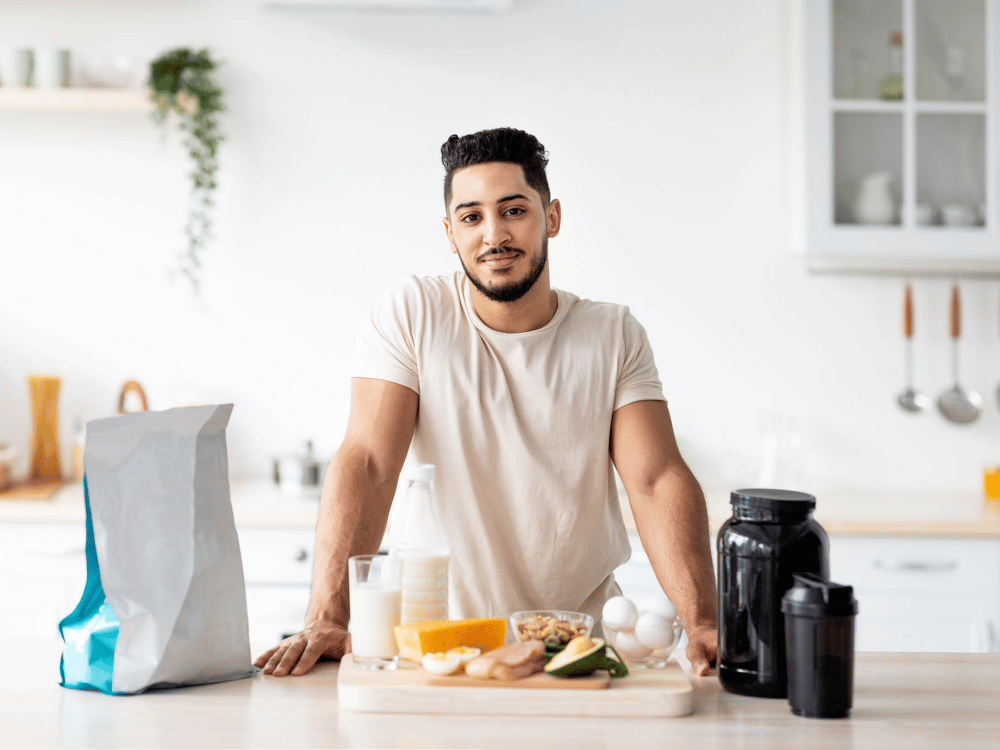 a person sitting at a table with a plate of food