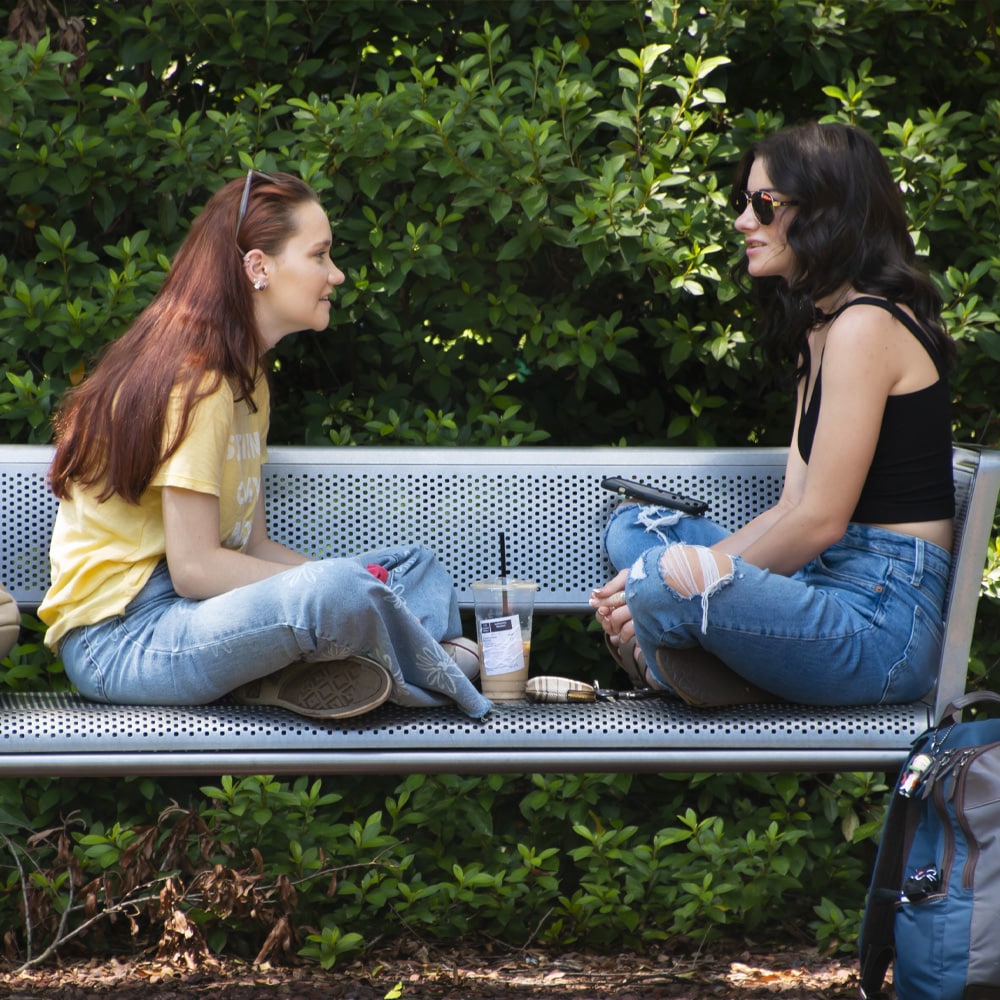 a woman sitting on a bench