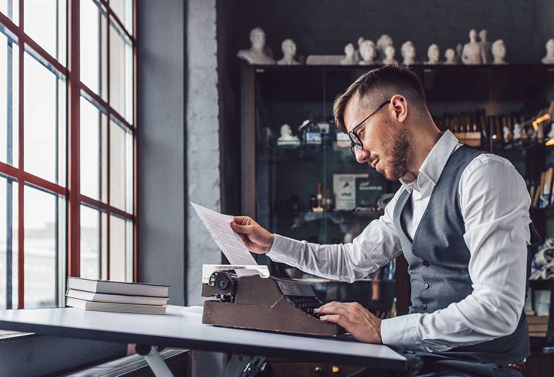 A writer sitting at his typewriter