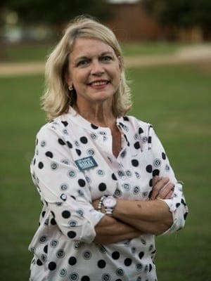 a person standing in the grass