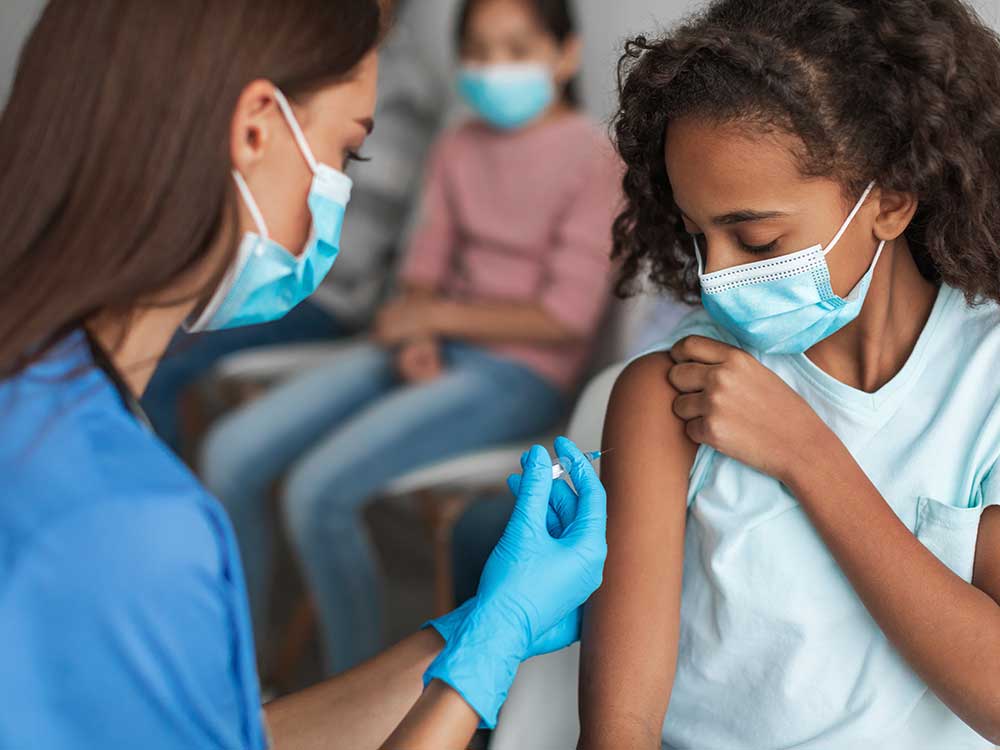 A nurse giving a vaccine.