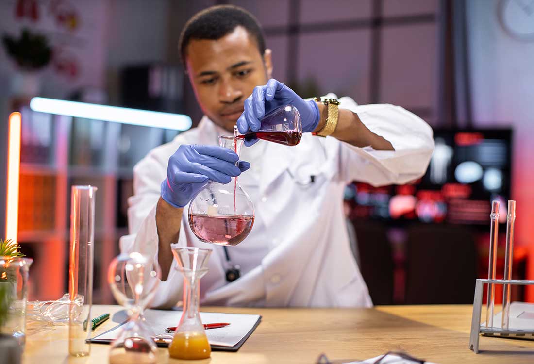 young male chemistry student in the lab