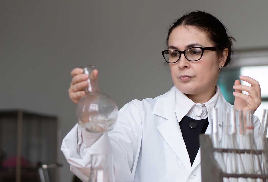 a female chemist wearing glasses