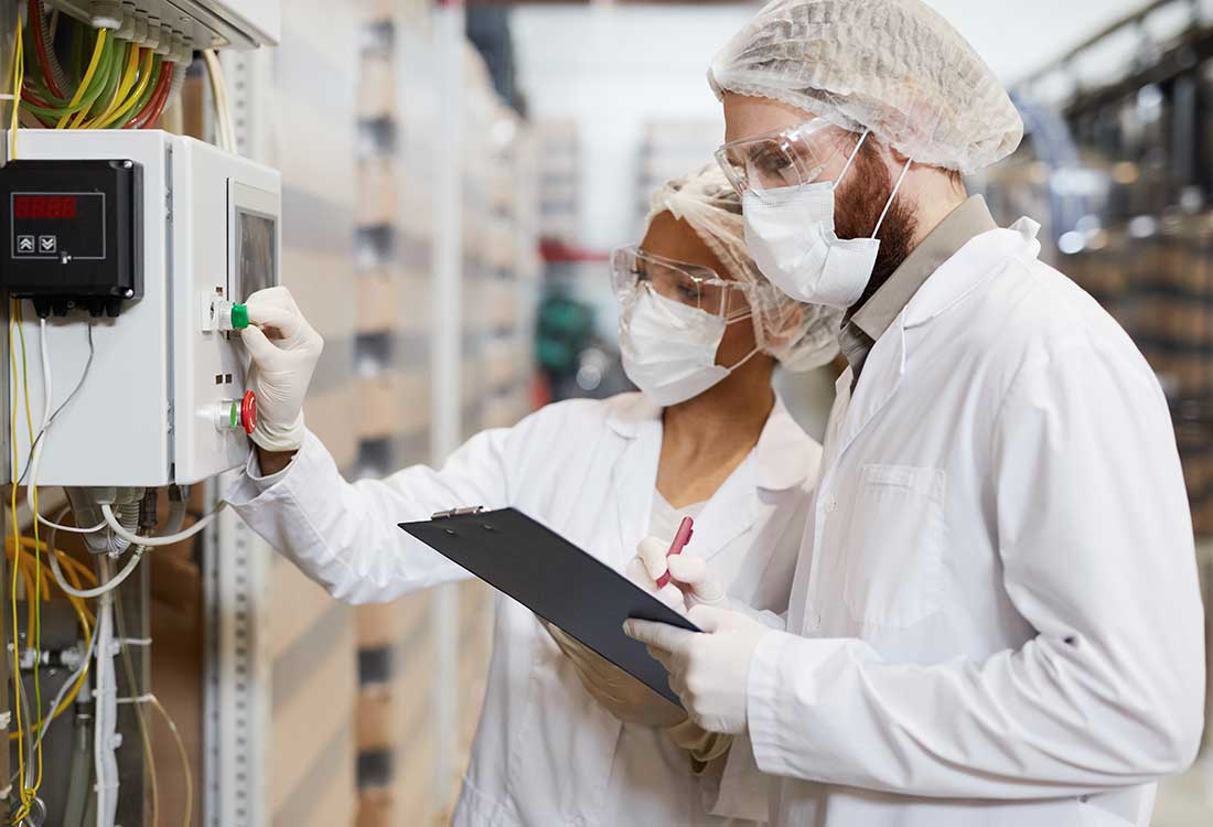 two chemist setting up an test