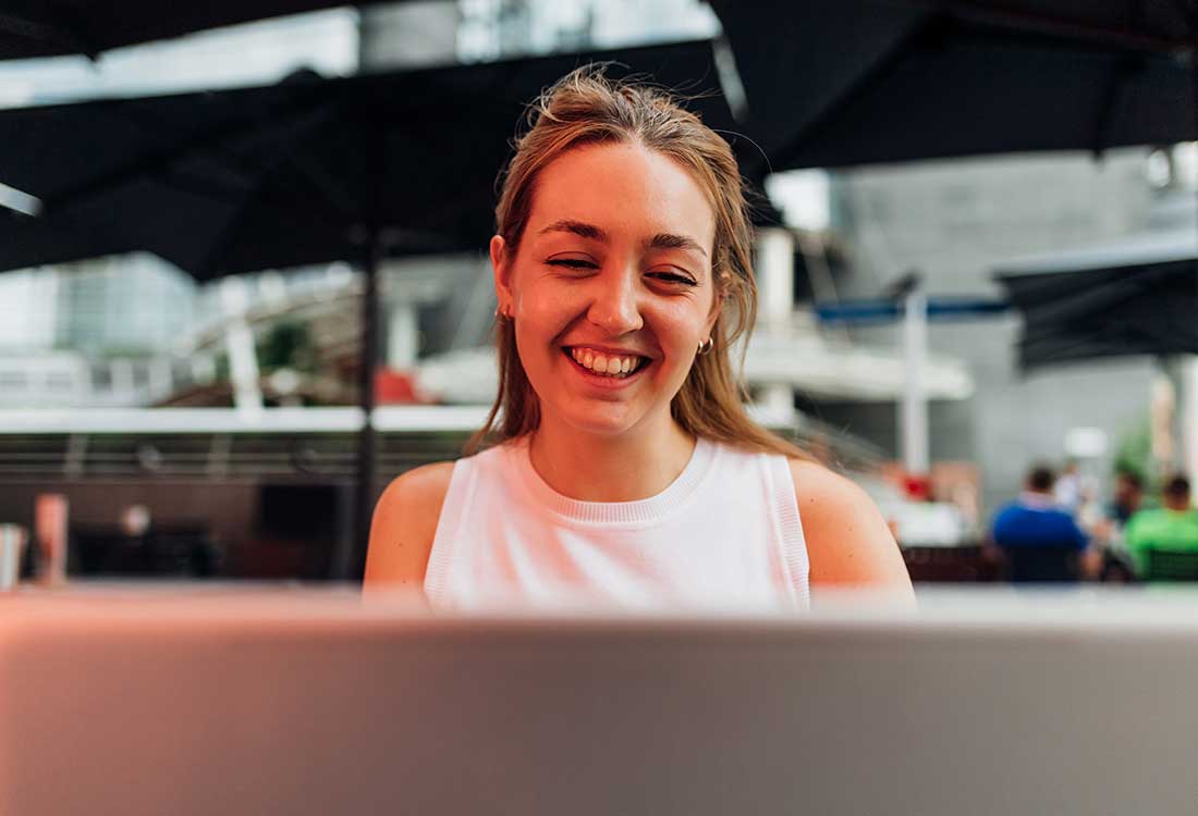 a woman looking at a laptop