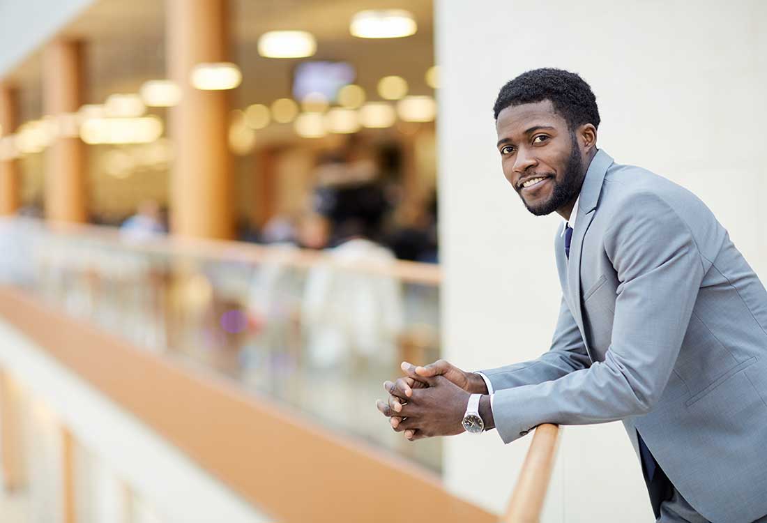 a man standing in front of a building