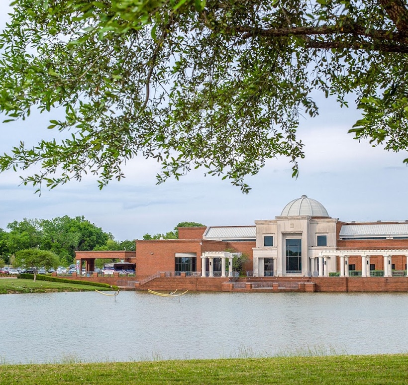 a large body of water in front of a house