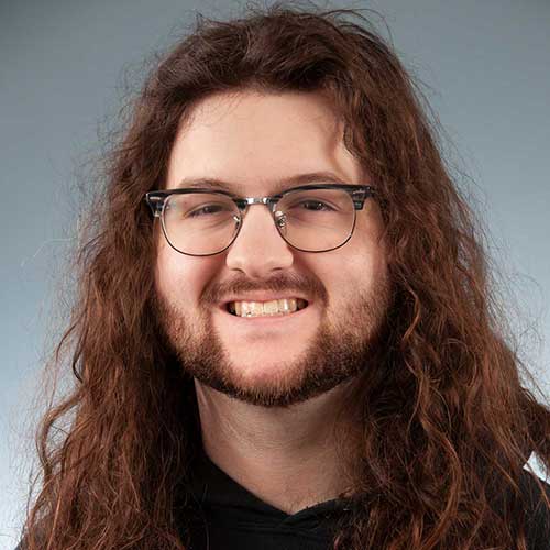 a close up of a man wearing glasses