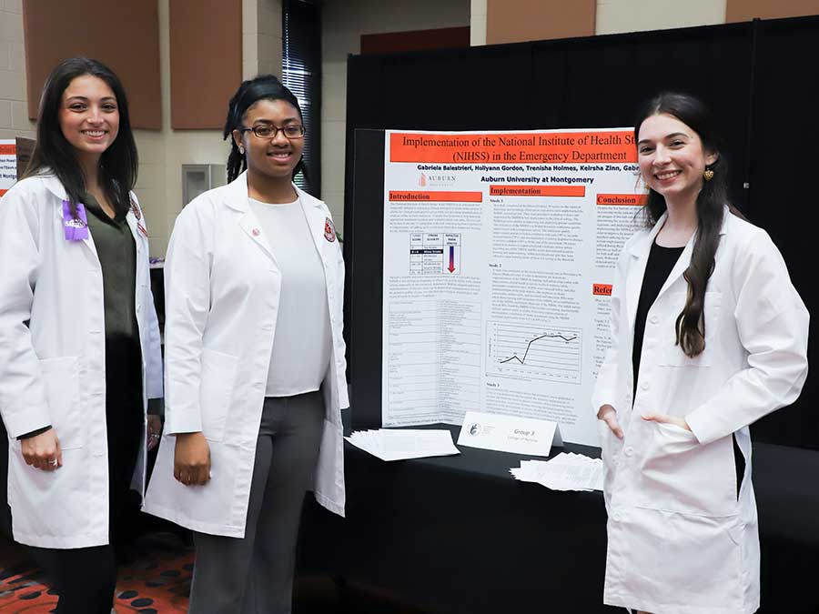 Students present their research through poster presentations.