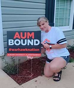 a person holding a sign in front of a building