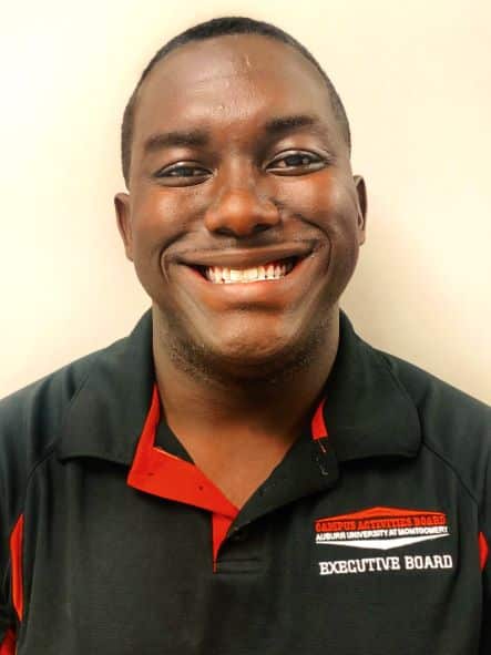 a man wearing glasses and smiling at the camera a man wearing glasses and smiling at the camera