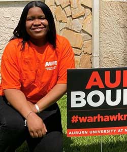 a woman holding a sign