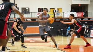 a group of people playing a game of basketball