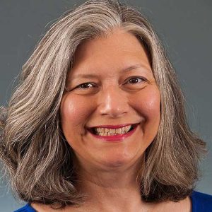 a close up of a woman smiling for the camera