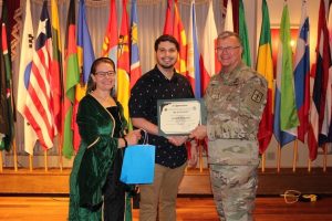Evan Mott accepting military award