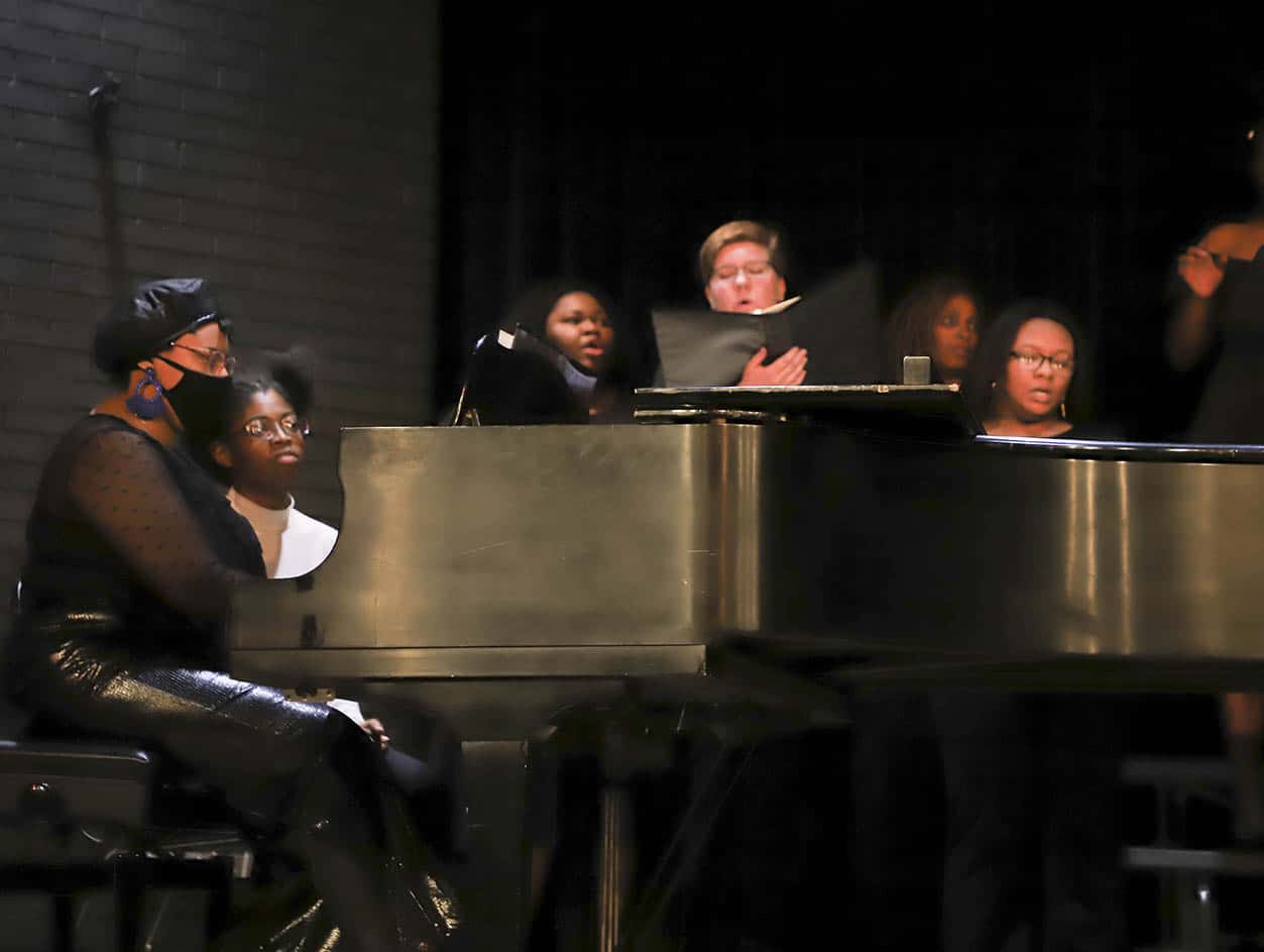 a group of people performing on a stage