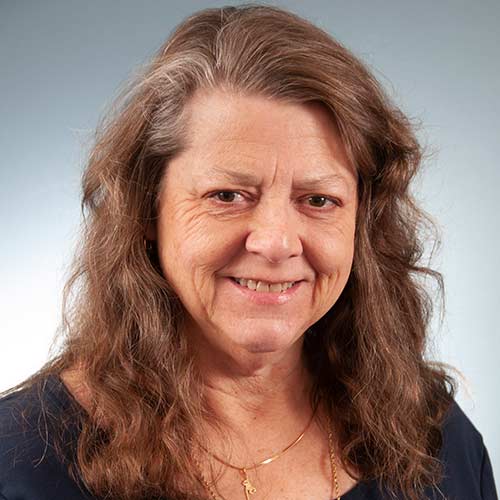 a woman smiling for the camera