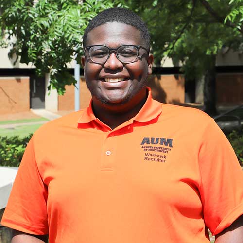 a man in orange shirt