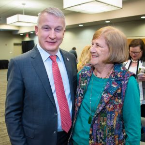 Dr. Rick Bright reconnects with a former AUM professor, Nancy Anderson, during the university's 2022 Clinical & Medical Laboratory Science Symposium.