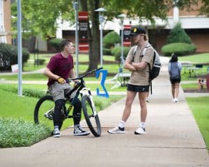 a person riding on the back of a bicycle