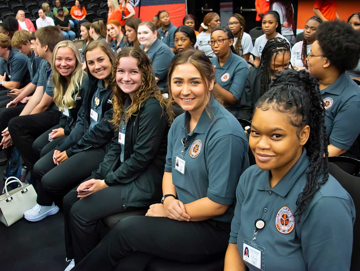 a group of people sitting posing for the camera