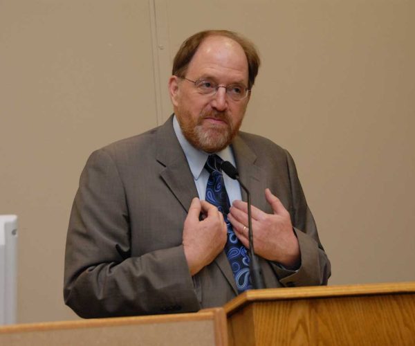 James K. Galbraith Wearing A Suit And Tie