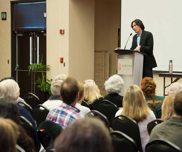 Paul K. Chappell Et Al. Standing In Front Of A Crowd