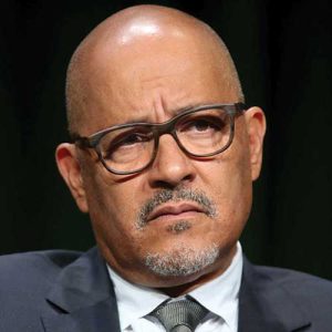 Clark Johnson Wearing Glasses And A Suit And Tie