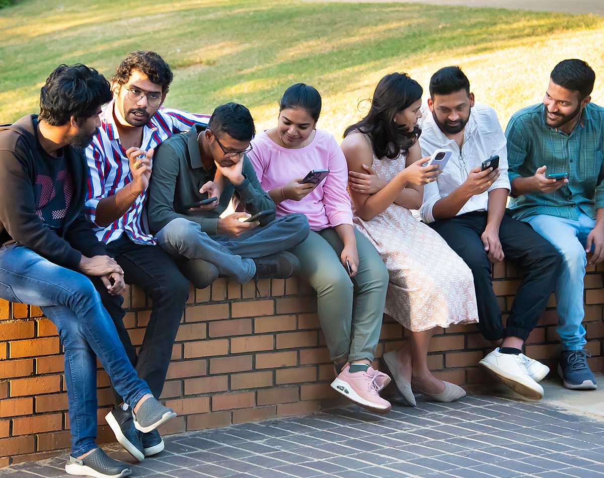 a group of people sitting on a bench