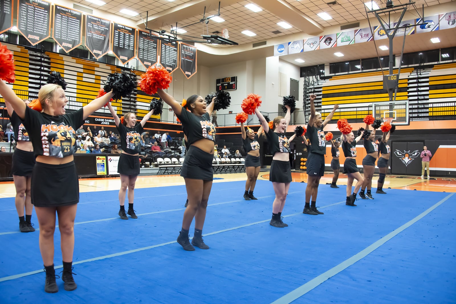 a group of people walking on the court