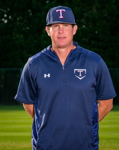 a man standing on a baseball field