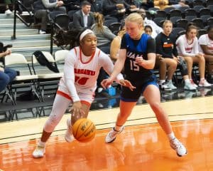 a group of people playing a game of basketball