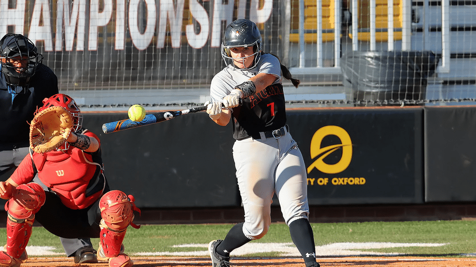a baseball player swinging a bat at a ball