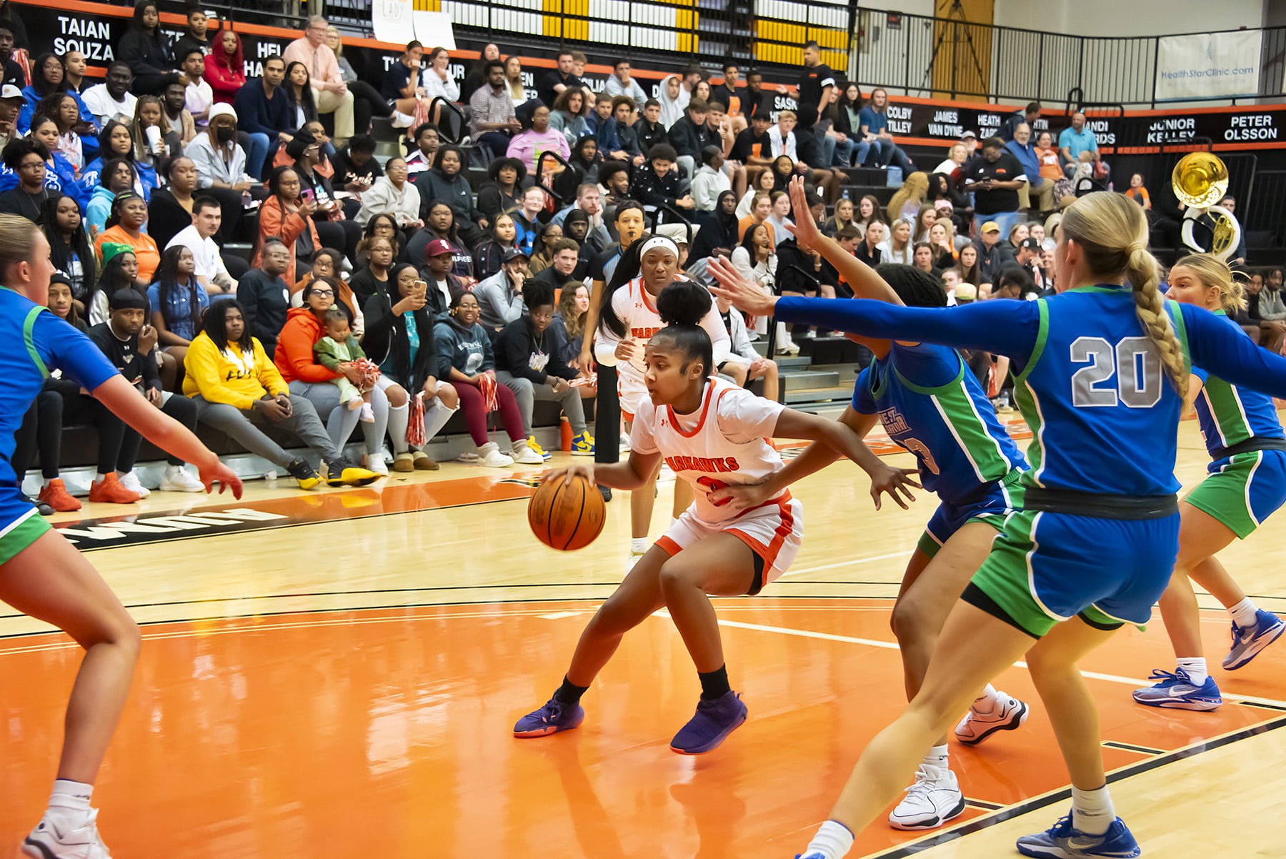 a group of people playing a game on the court