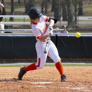 a baseball player swinging a bat at a ball