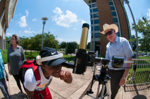Associate professor Randy Russell assists with safe viewing of the 2017 solar eclipse.