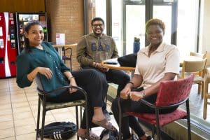 a group of people sitting in a chair