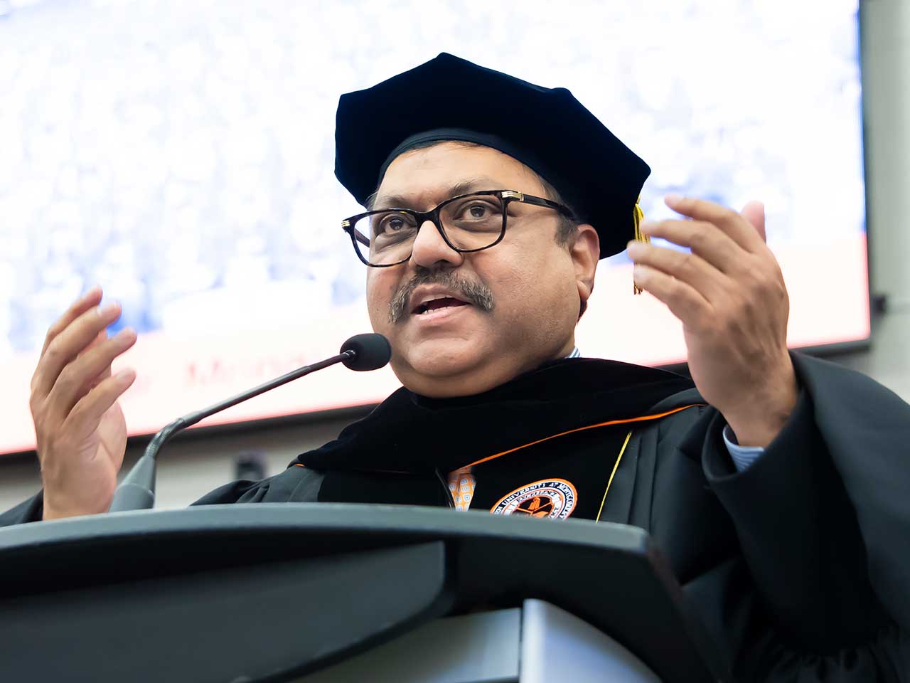 a man wearing a hat and glasses