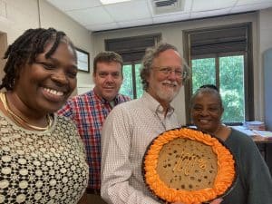 Wangari Maathai, Paul Hard standing in front of a cake