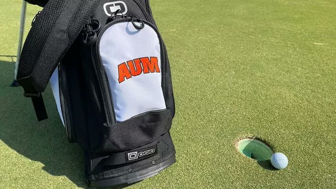 AUM Athletics' bag sits on the golf course.