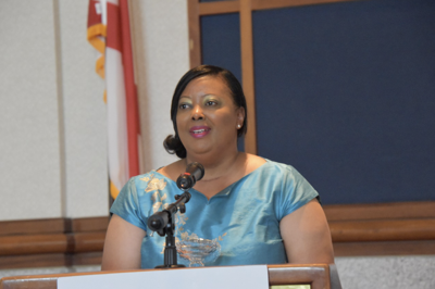LaShandra Warren Barnes speaks at a podium.