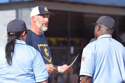 Mark Hall speaks with umpires.