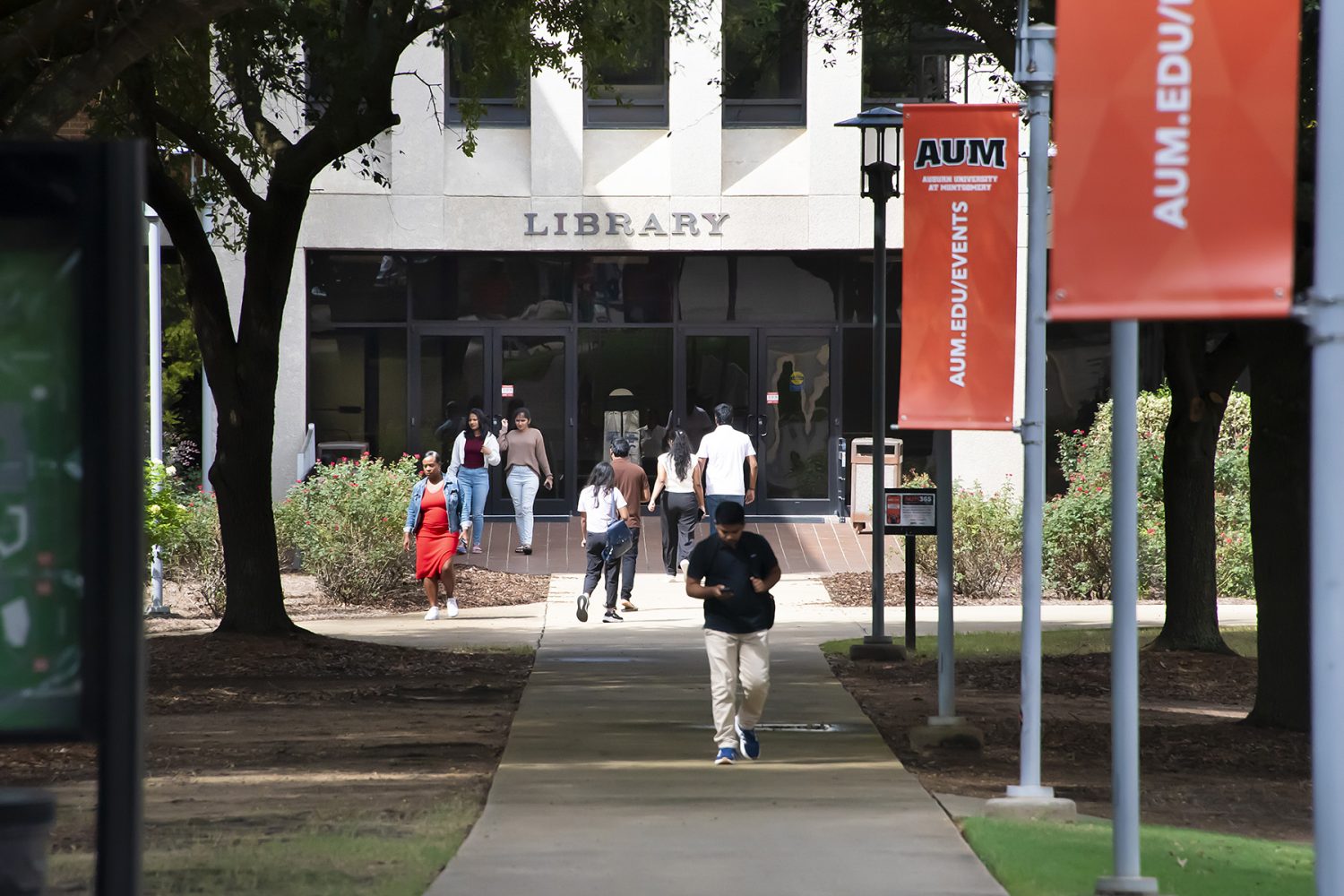 Students Walking Outside The AUM Library Tower