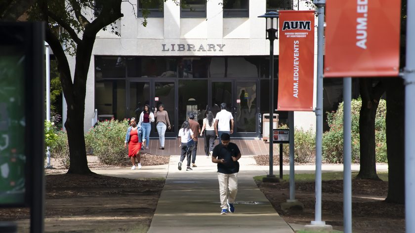 Students Walking Outside The AUM Library Tower